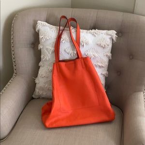 Bright orange leather tote/purse.